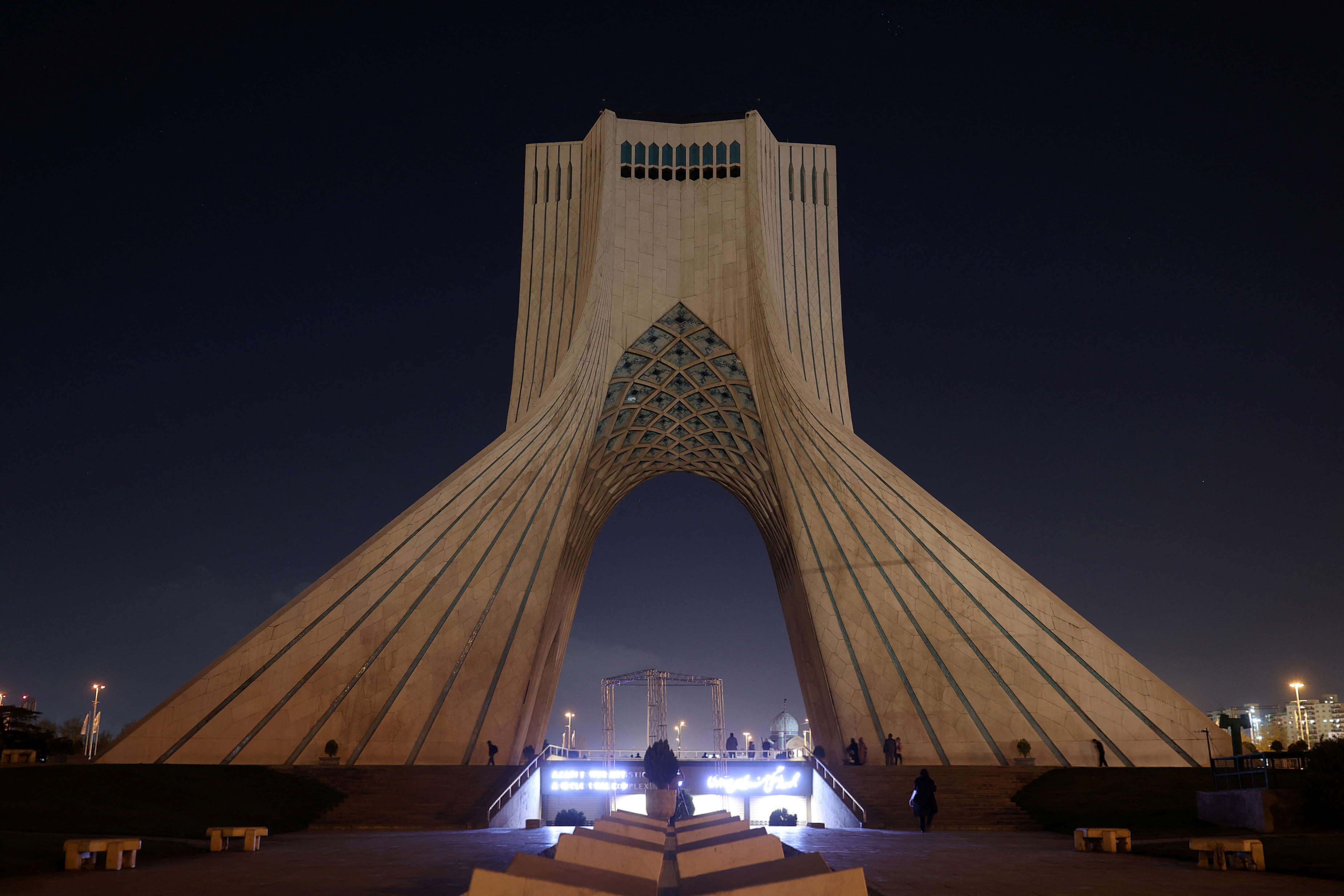 Azadi Tower is photographed after lights go out for Earth Hour in Tehran, Iran, March 26, 2022. Majid Asgaripur/Wana (WANA) via Reuters Attention Editors - This image was provided by a third party.