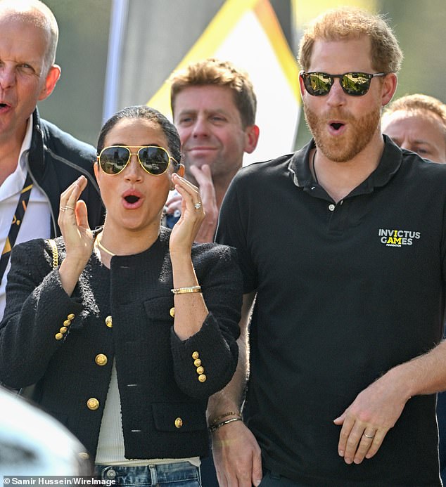 Pictured, Harry and Meghan interact during a driving challenge at the Invictus Games on April 16, 2022.