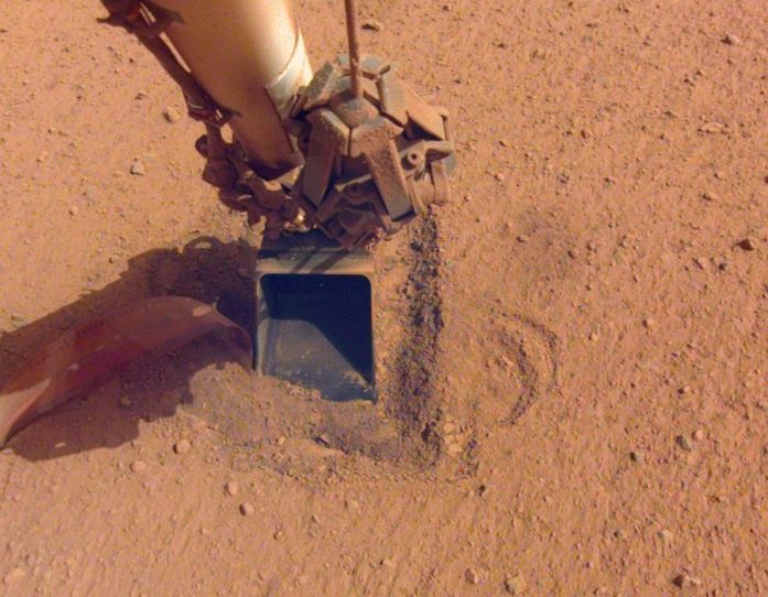 A probe studying Mars' internal heat aboard NASA's InSight lander has finished its mission, failing to get the friction it needs to drill.  (NASA/JPL-CALTECH)