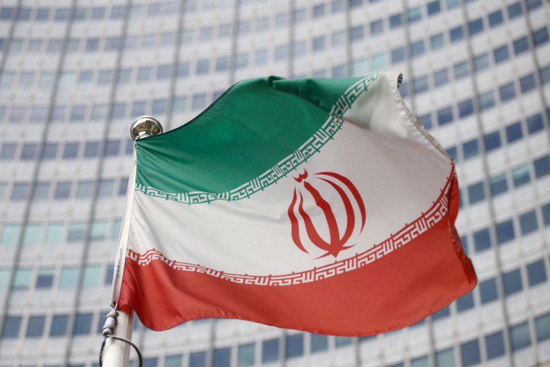 FILE PHOTO: Iran's flag in front of the International Atomic Energy Agency headquarters in Vienna, Austria on March 2, 2021. REUTERS/Lizzie Nessner