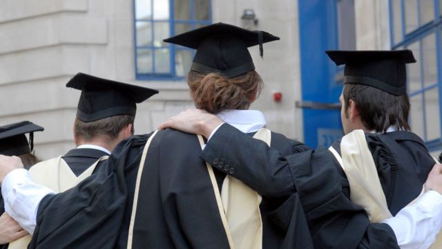 Back view of London School of Economics graduates wearing robes