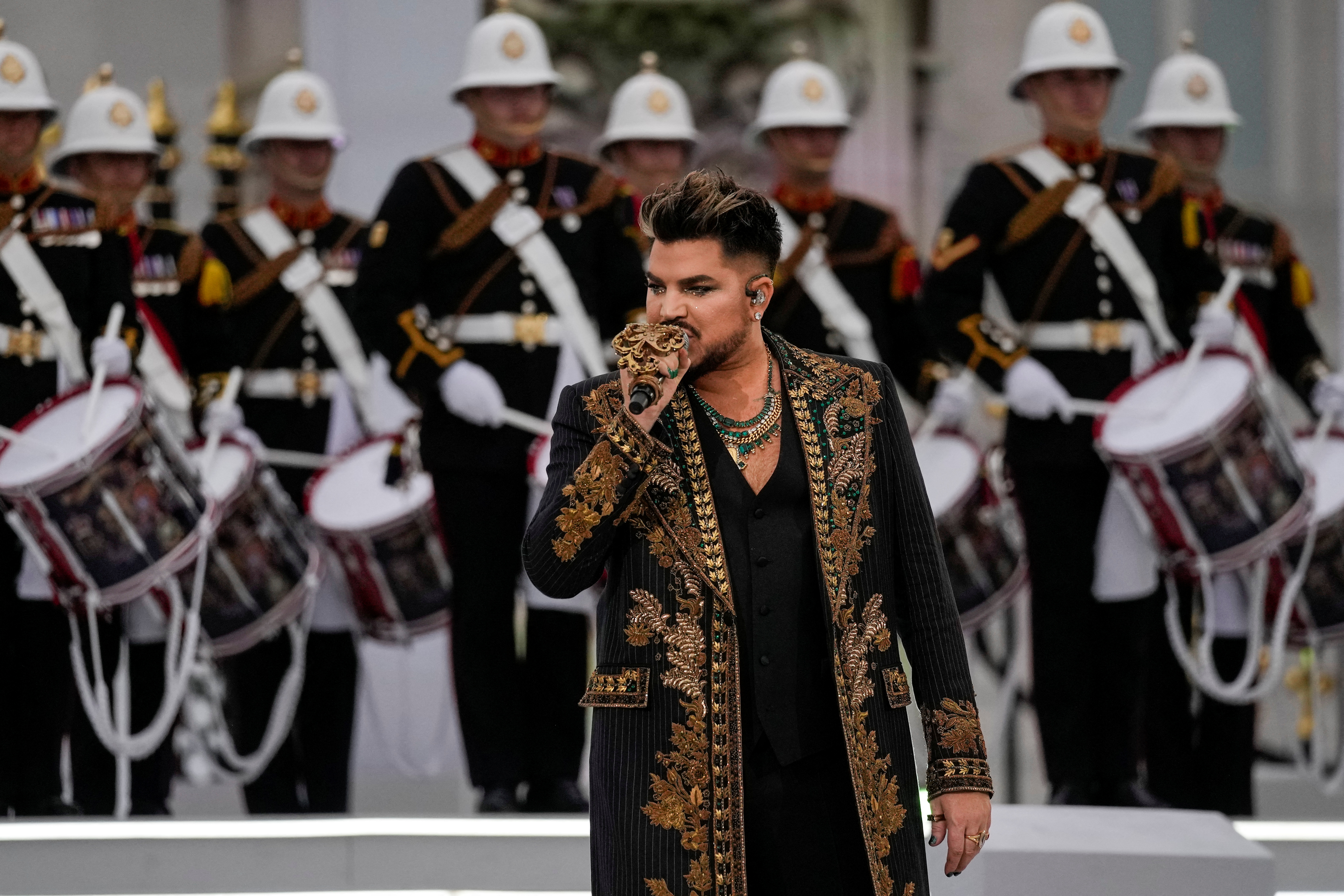 Adam Lambert, from Collaboration "The Queen + Adam Lambert"performs with Royal Navy drummers at the Queen Elizabeth Platinum Jubilee Gala outside Buckingham Palace on June 4, 2022 (Alastair Grant/REUTERS)