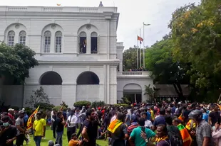 Demonstrators calling for the resignation of Sri Lankan President Gotabaya Rajapaksa gather inside the Sri Lankan Presidential Palace complex in Colombo on July 9, 2022.