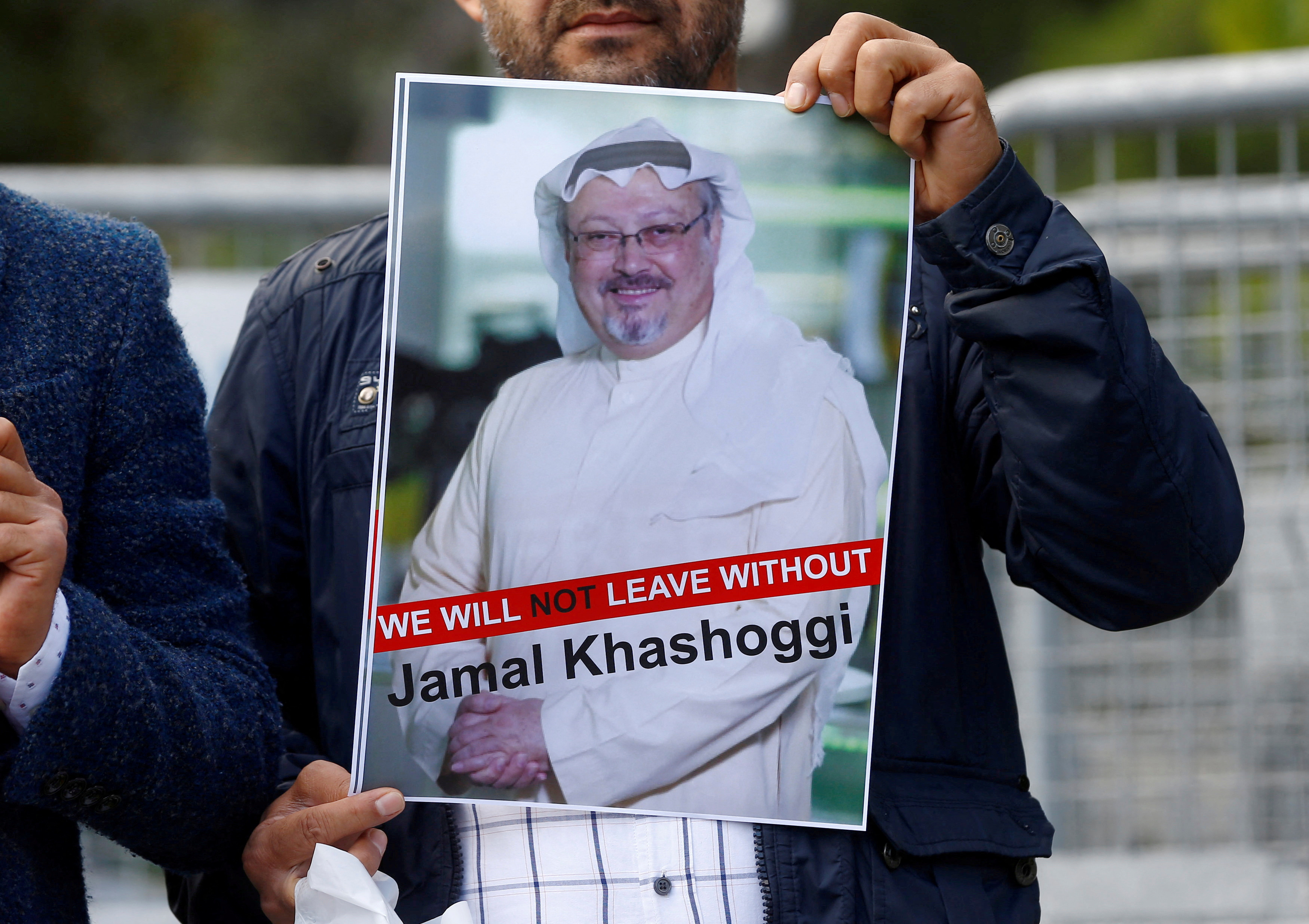 A protester holds a poster of Jamal Khashoggi (Reuters/Othman Ursal)