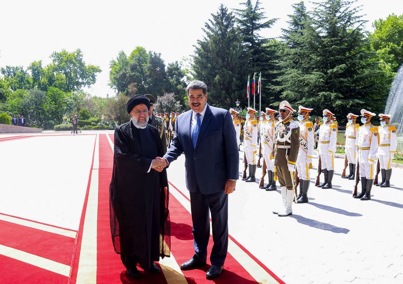 Iranian President Ebrahim Raisi shakes hands with Venezuelan dictator Nicolas Maduro during a reception in Tehran, Iran on June 11, 2022. President's website / WANA (West Asian News Agency) / Posted via Reuters