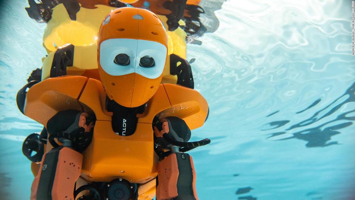 A human diving robot explores shipwrecks at the bottom of the ocean