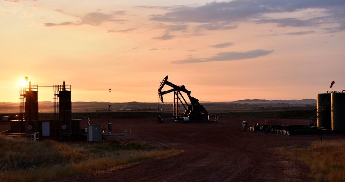 An oil well is seen at sunrise on August 25, 2021 in Watford, North Dakota.