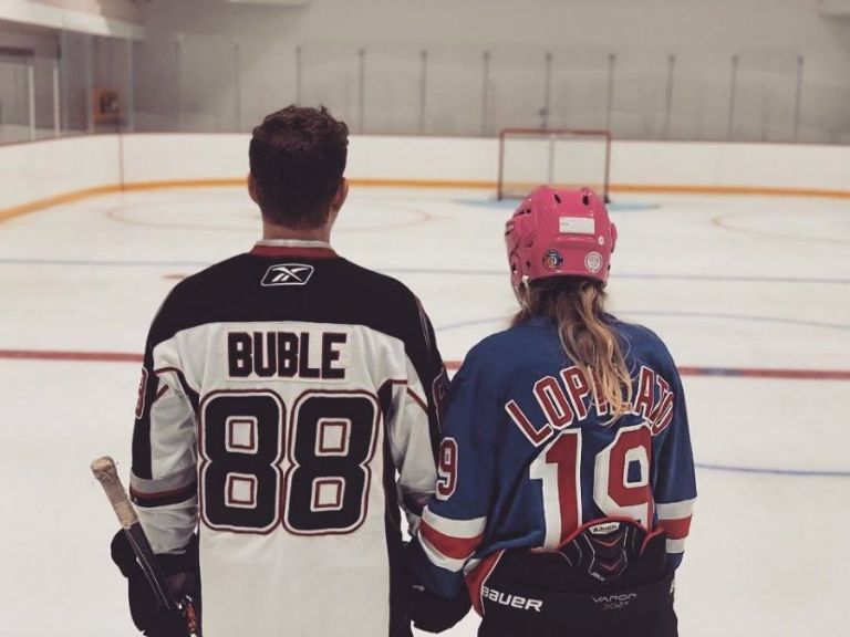 Luisana Lopilato and Michael Bublé, on the ice hockey rink in their mansion.
