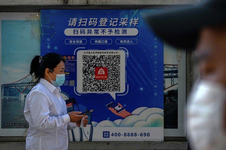 QR code to check health status in Beijing.  AP . photos
