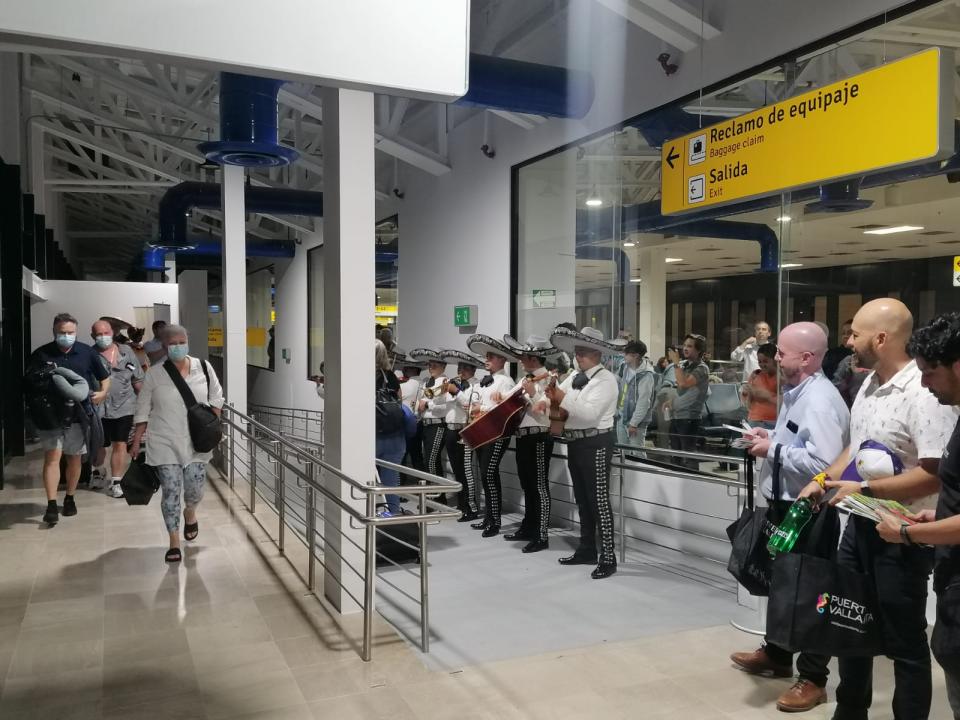 Puerto Vallarta International Airport staff wait with mariachi for tourists from Vancouver, Canada