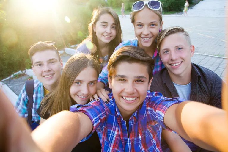 Taking selfies at any time of the day can present risks for minors (Image: Adobe Stock)